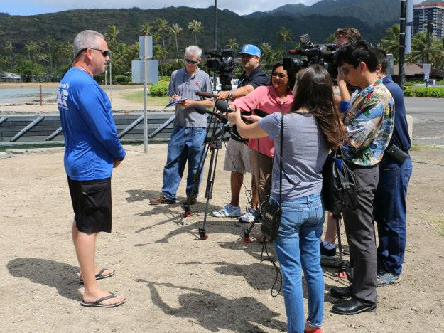 Answering media questions about the coral disease response. Photo © Hawaii Division of Aquatic Resources