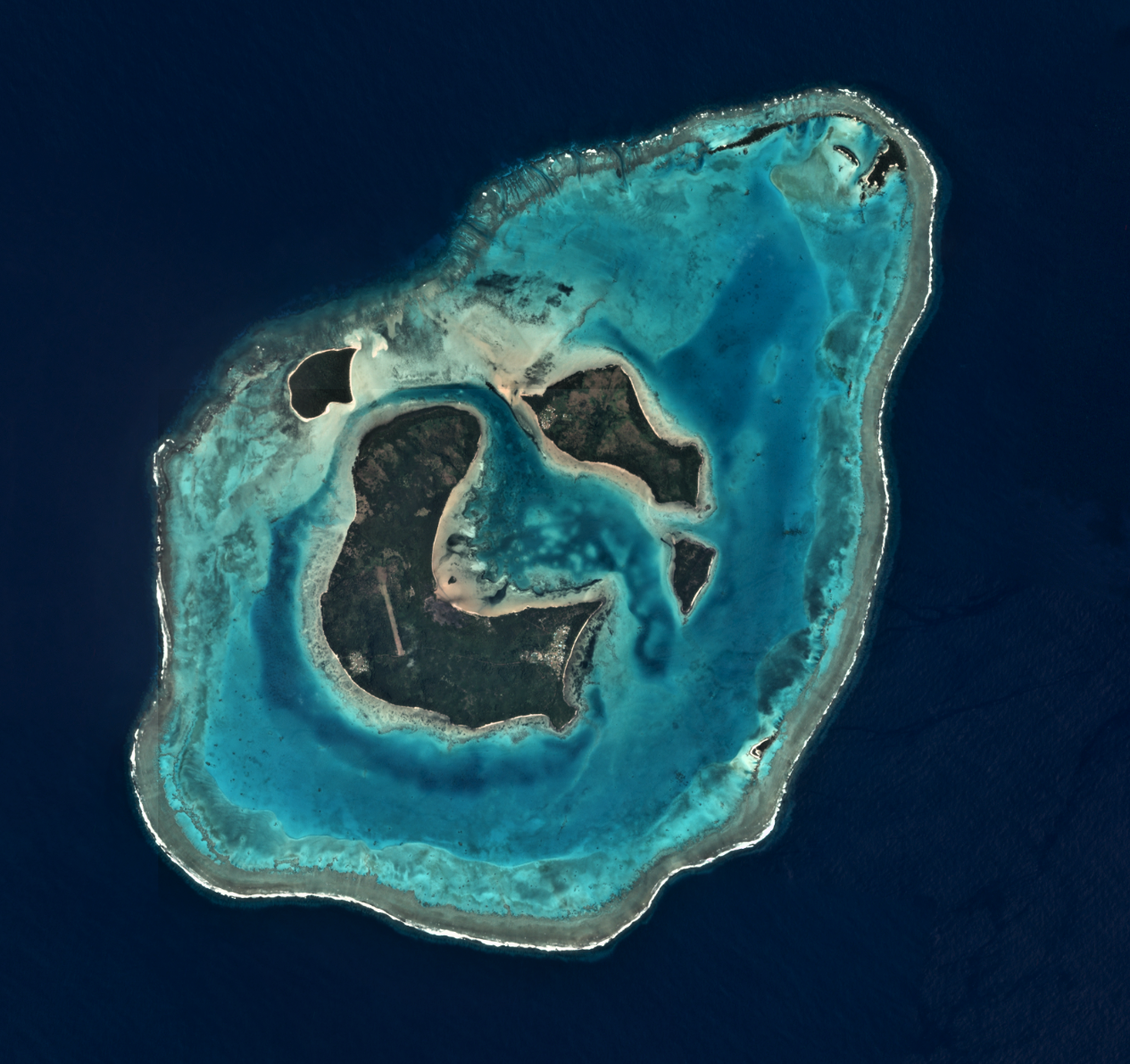 Satellite image of the village of Nukuni on Ono-i-Lau, Fiji. Ono-i-Lau is a group of islands within a barrier reef system in the Fijian archipelago of Lau Islands. Photo © Planet Labs Inc.