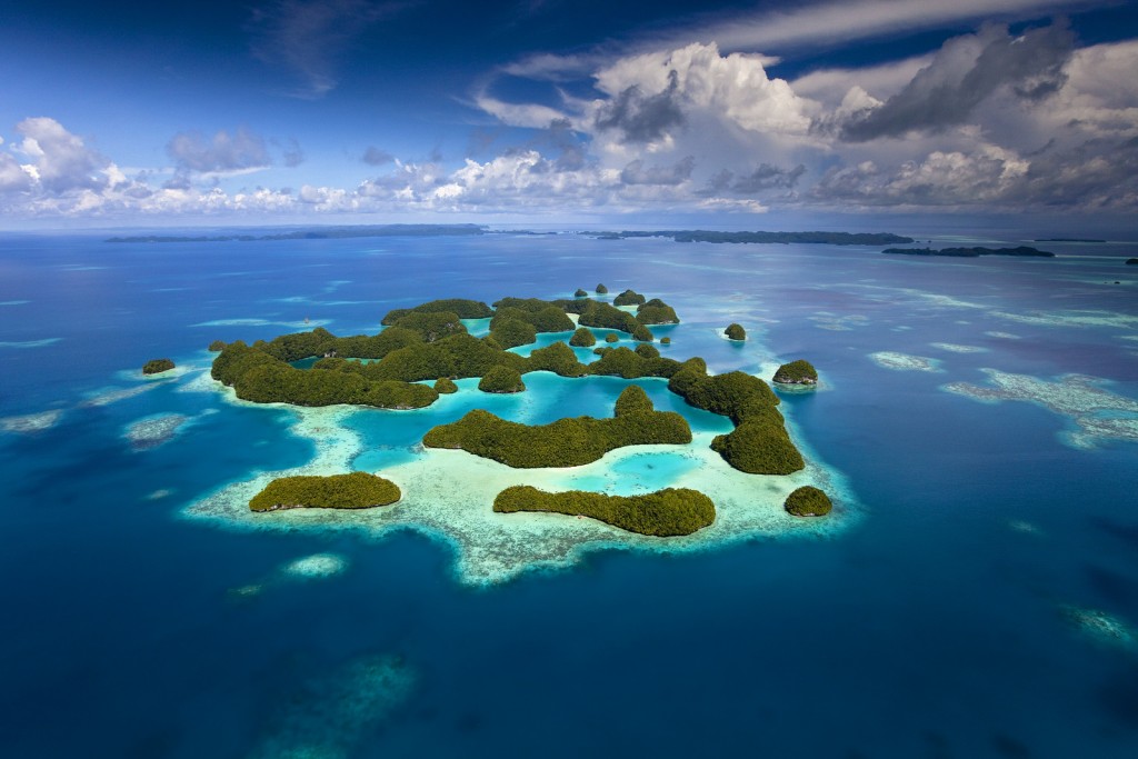 Aerial view of Palau known as "70 Mile Islands" as well as the rich coral reef surrounding them. Photo © Ian Shive
